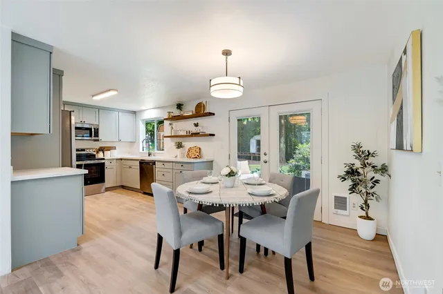 a dining room with furniture and window