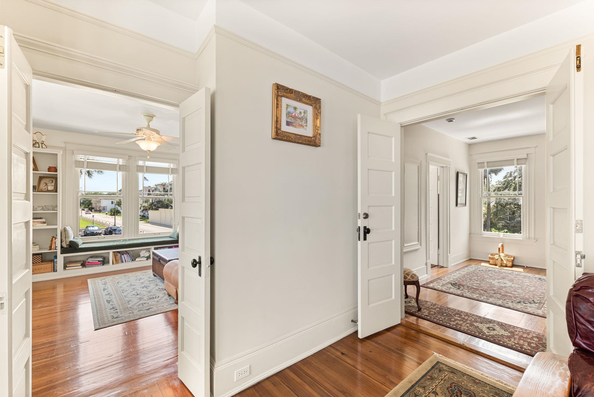 178 Avenida Menendez St. Augustine, FL 32084 - Photo 23 of 42 a bedroom with a bed and wooden floor