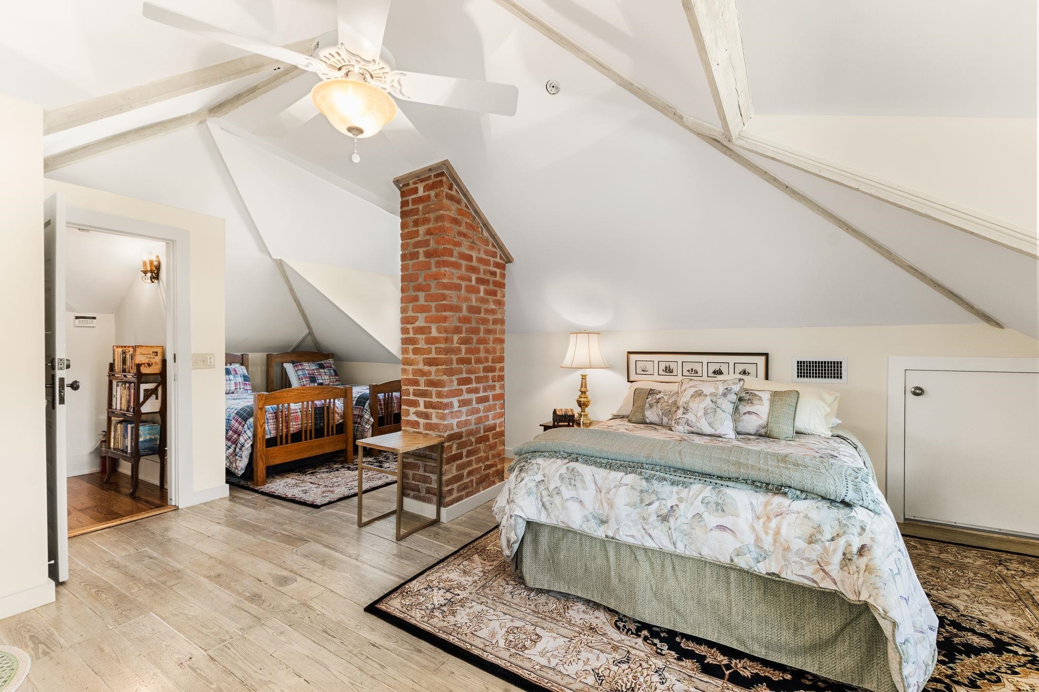 178 Avenida Menendez St. Augustine, FL 32084 - Photo 32 of 42 a bedroom with a bed and a chandelier