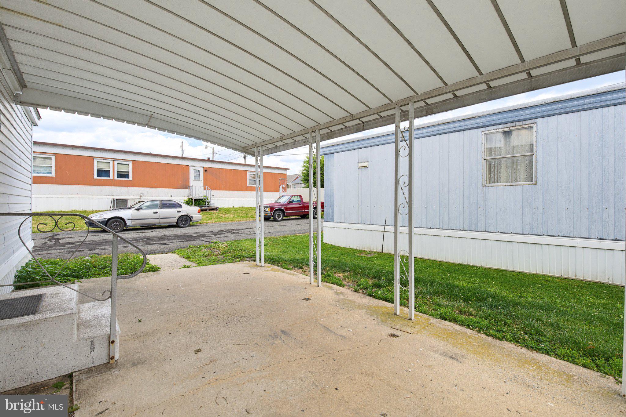 475 Wabash Road Ephrata, PA 17522 - Photo 6 of 33 Covered entryway with green lawn view.