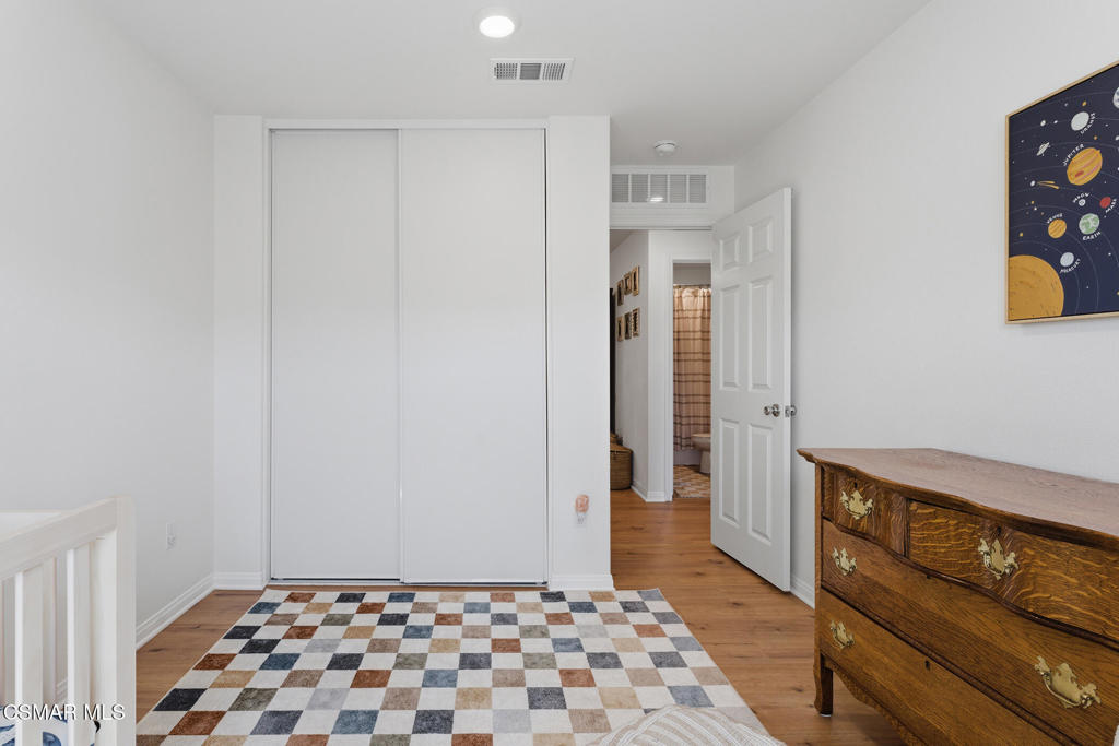 512 Mulberry Lane Fillmore, CA 93015 - Photo 28 of 54 a view of a hallway with wooden floor and cabinet