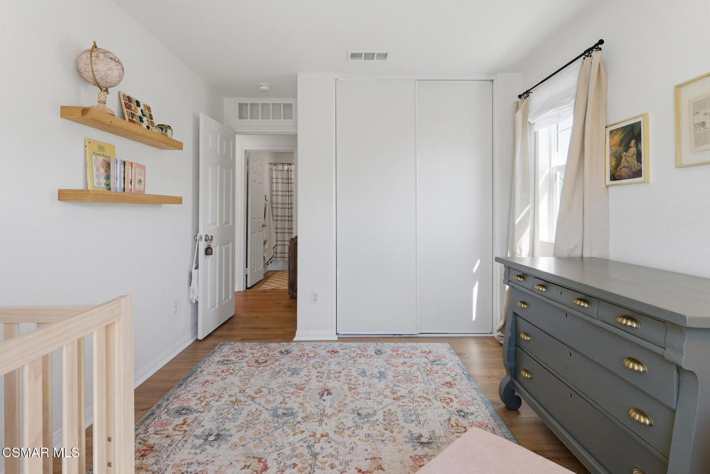 512 Mulberry Lane Fillmore, CA 93015 - Photo 32 of 54 a view of a bedroom with wooden floor and closet
