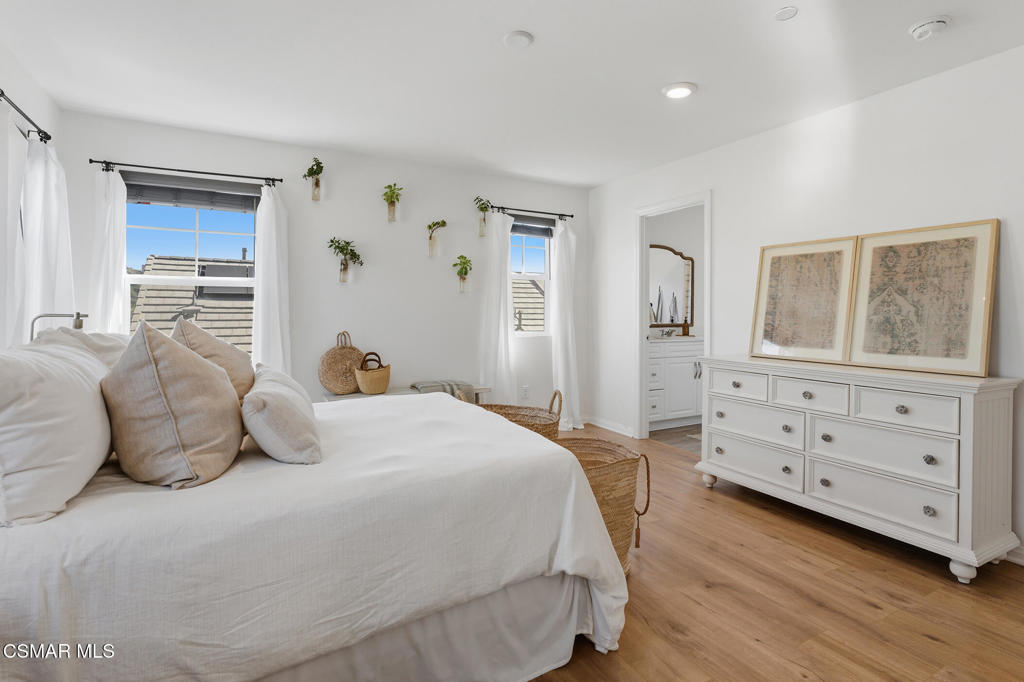 512 Mulberry Lane Fillmore, CA 93015 - Photo 34 of 54 a bedroom with a bed and wooden floor