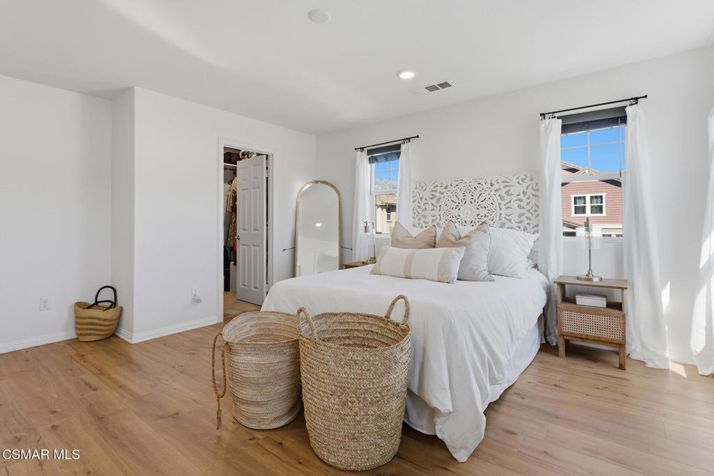 512 Mulberry Lane Fillmore, CA 93015 - Photo 35 of 54 a bedroom with a bed and wooden floor