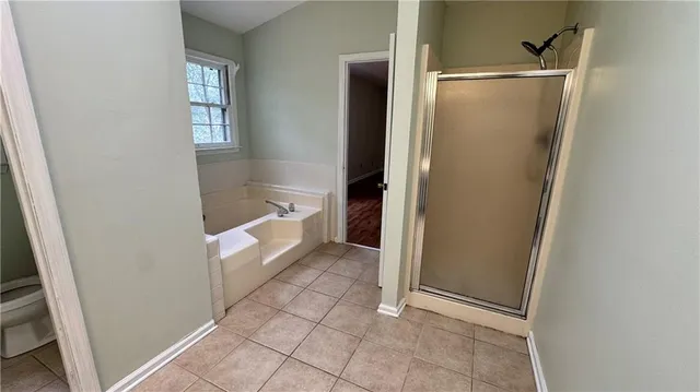 a bathroom with a bathtub and shower