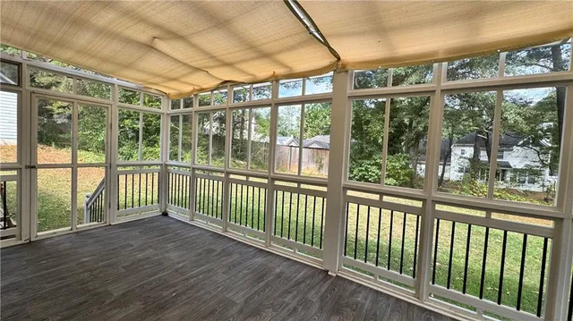 a view of a balcony with wooden floor