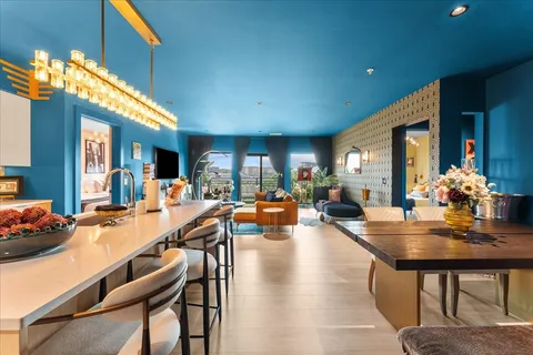 a dining hall with dining table and chairs