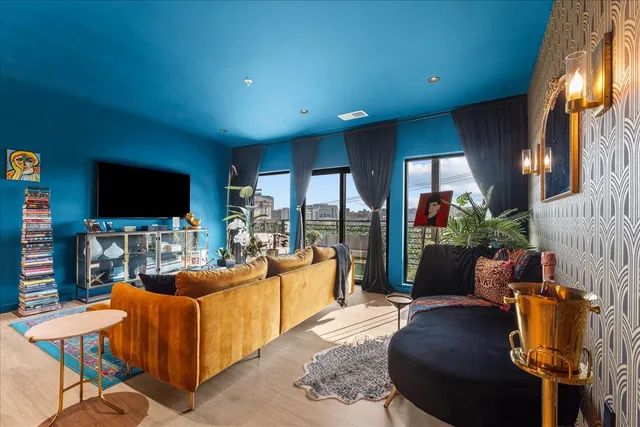 a living room with furniture and a large window