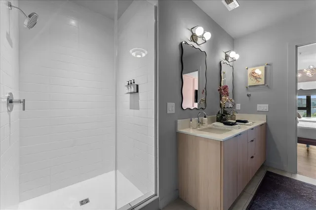 a living room with flat screen tv and a walk in closet