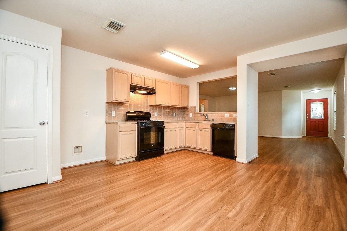 29530 Legends Glen Drive Spring, TX 77386 - Photo 14 of 50 a kitchen with a refrigerator and a stove top oven