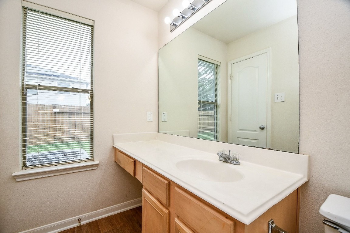29530 Legends Glen Drive Spring, TX 77386 - Photo 32 of 50 a bathroom with a sink vanity and a mirror