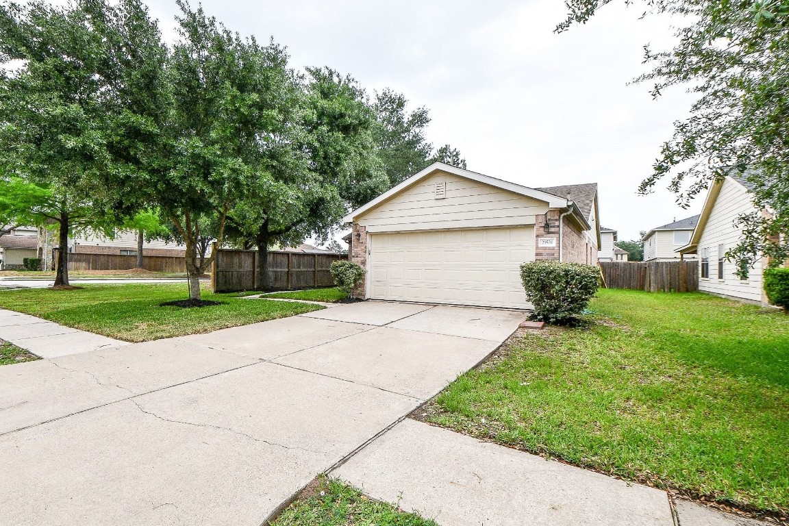 29530 Legends Glen Drive Spring, TX 77386 - Photo 4 of 50 a front view of a house with a yard