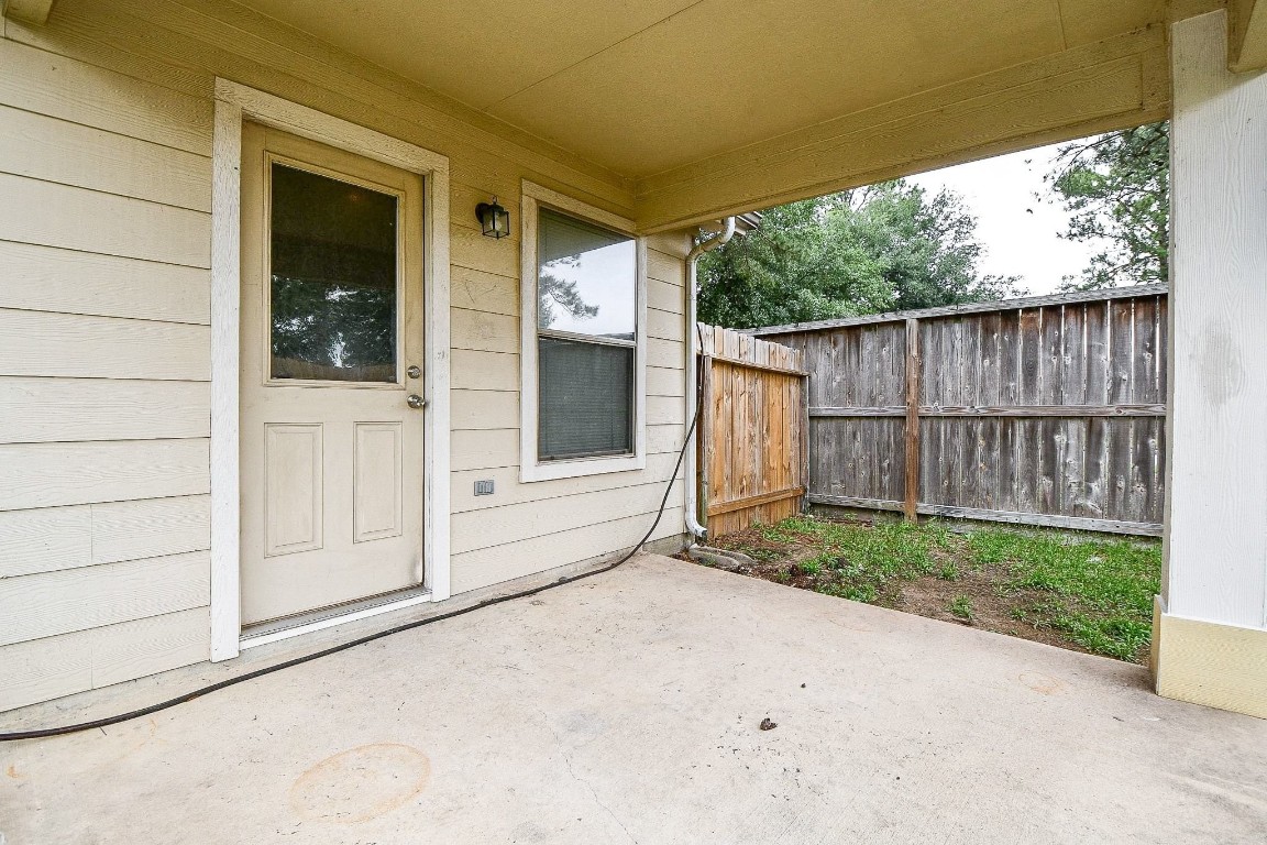 29530 Legends Glen Drive Spring, TX 77386 - Photo 42 of 50 a view of backyard with small cabin and wooden fencing