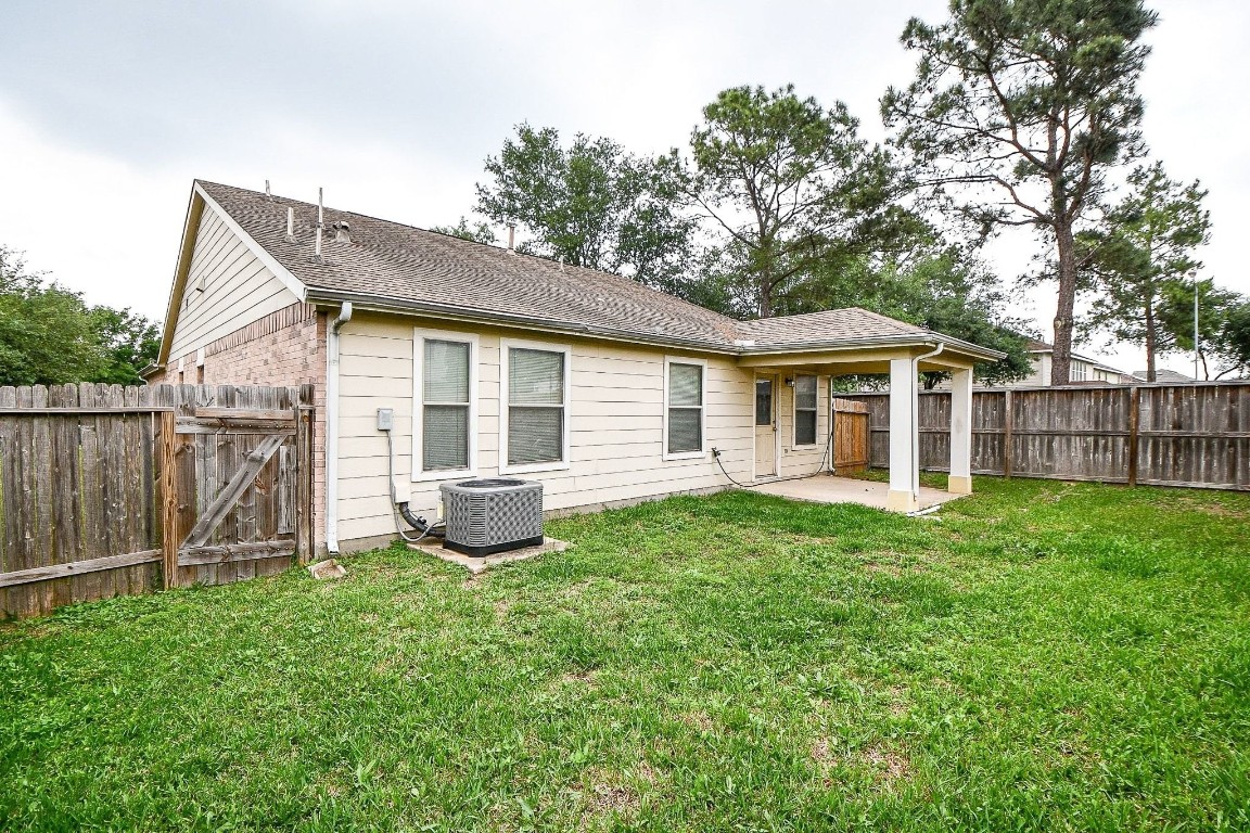 29530 Legends Glen Drive Spring, TX 77386 - Photo 45 of 50 a view of a house with backyard and a tree