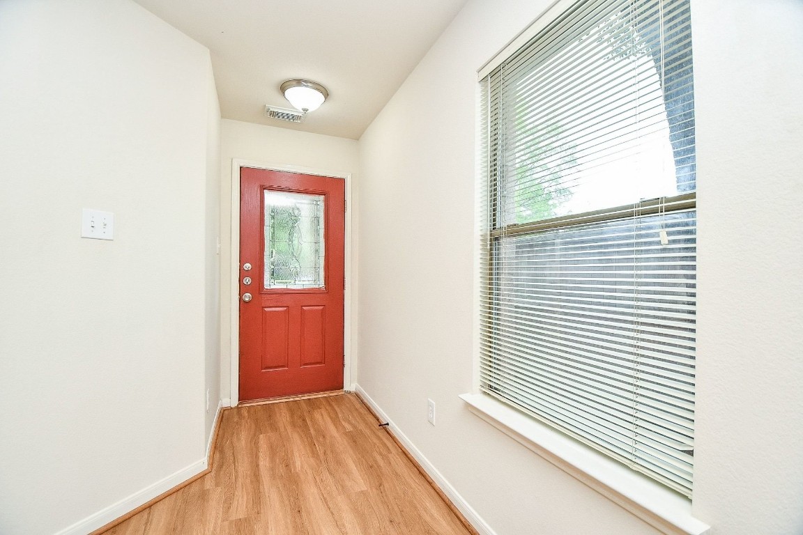 29530 Legends Glen Drive Spring, TX 77386 - Photo 6 of 50 a view of a room with a window and wooden floor