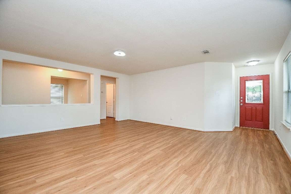 29530 Legends Glen Drive Spring, TX 77386 - Photo 10 of 50 a view of an empty room with window and wooden floor
