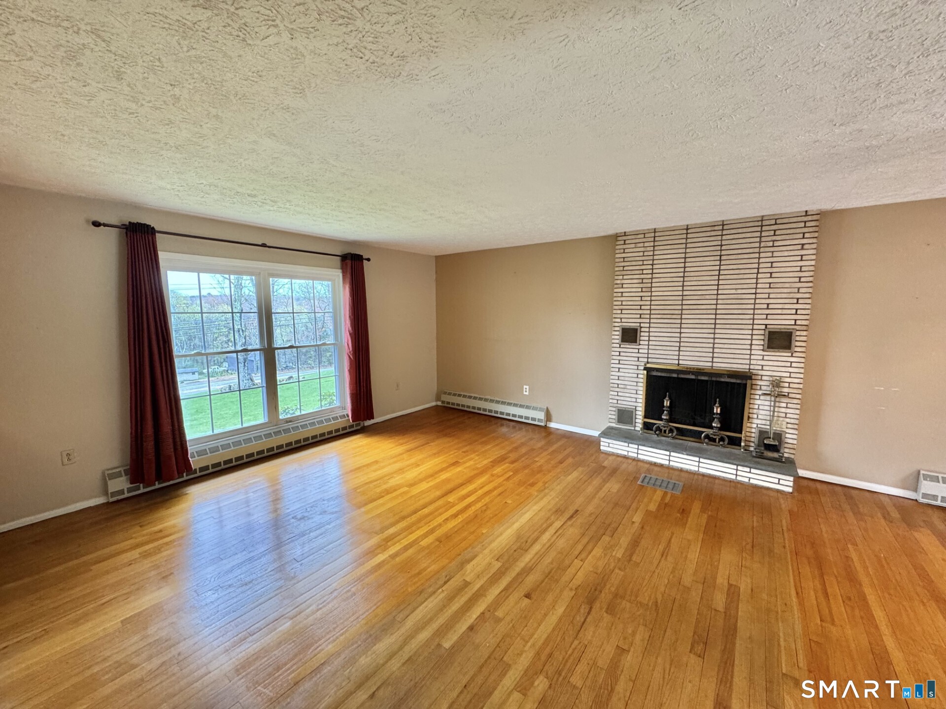 319 Jones Hollow Road Marlborough, CT 06447 - Photo 2 of 23 Living room with fireplace.