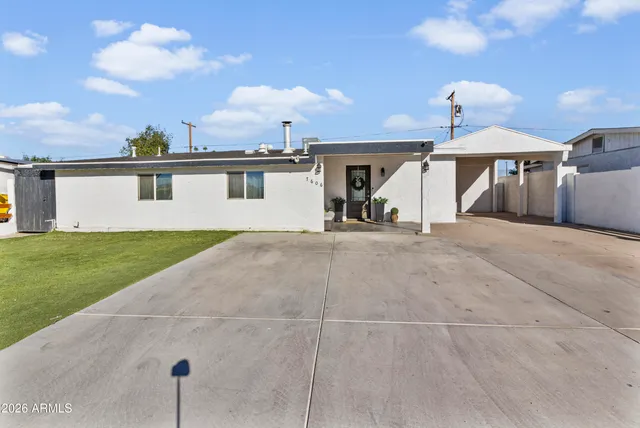 a view of house with yard and entertaining space