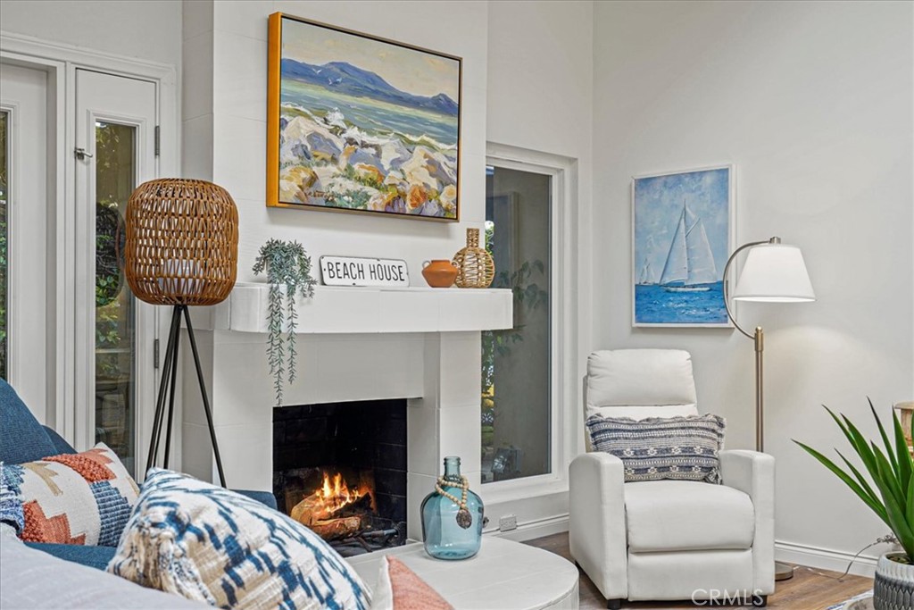 23802 Cassandra Bay Dana Point, CA 92629 - Photo 16 of 56 a living room with furniture and a fireplace