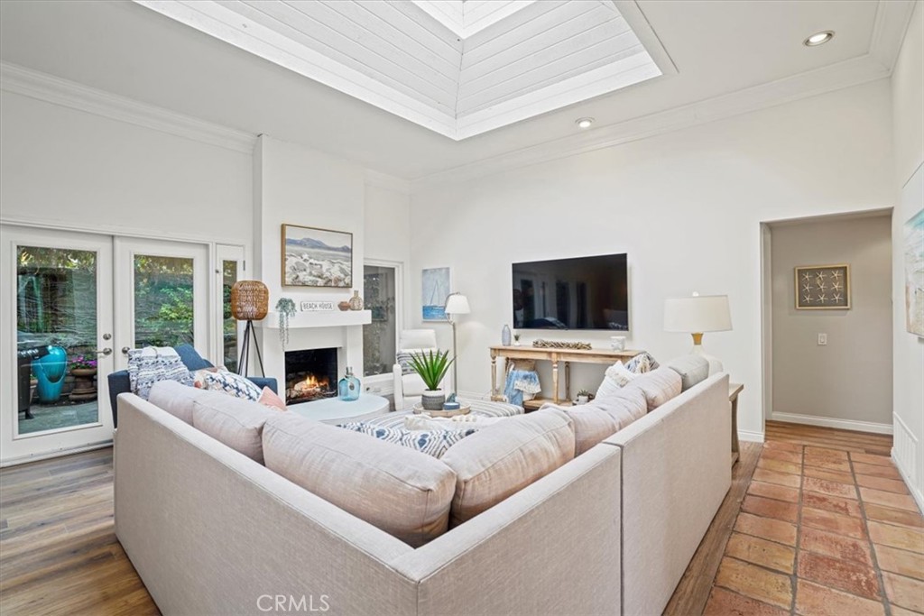 23802 Cassandra Bay Dana Point, CA 92629 - Photo 17 of 56 a living room with furniture a flat screen tv and a fireplace