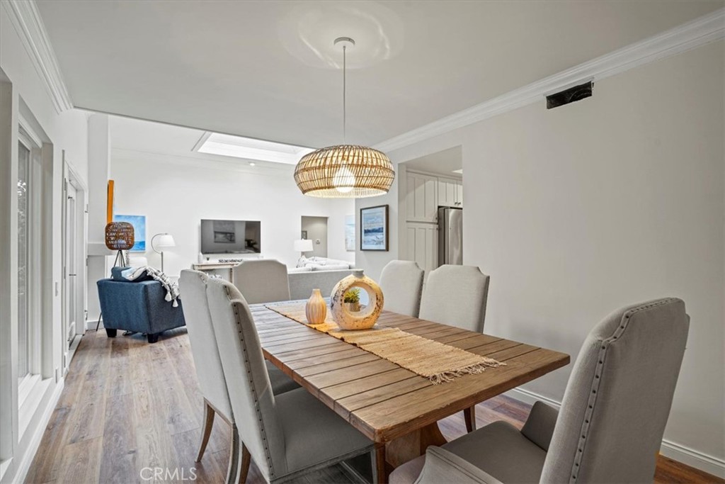 23802 Cassandra Bay Dana Point, CA 92629 - Photo 21 of 56 a view of a dining room with furniture window and wooden floor