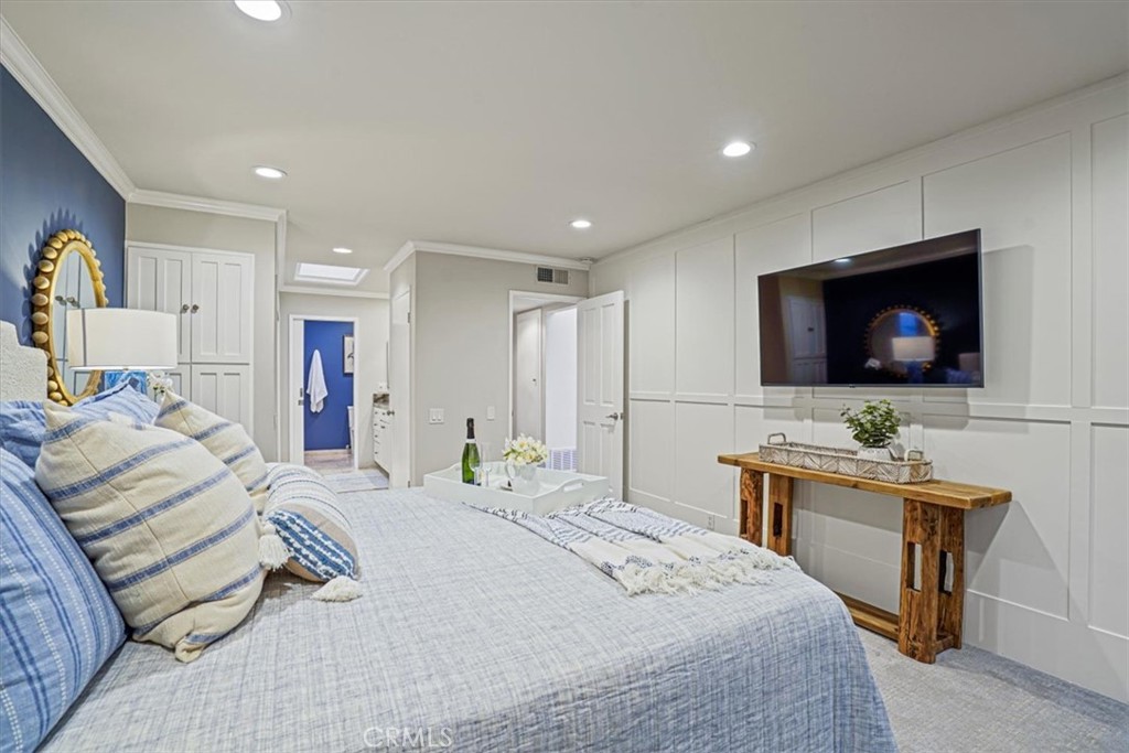 23802 Cassandra Bay Dana Point, CA 92629 - Photo 32 of 56 a bedroom with a bed and a flat screen tv