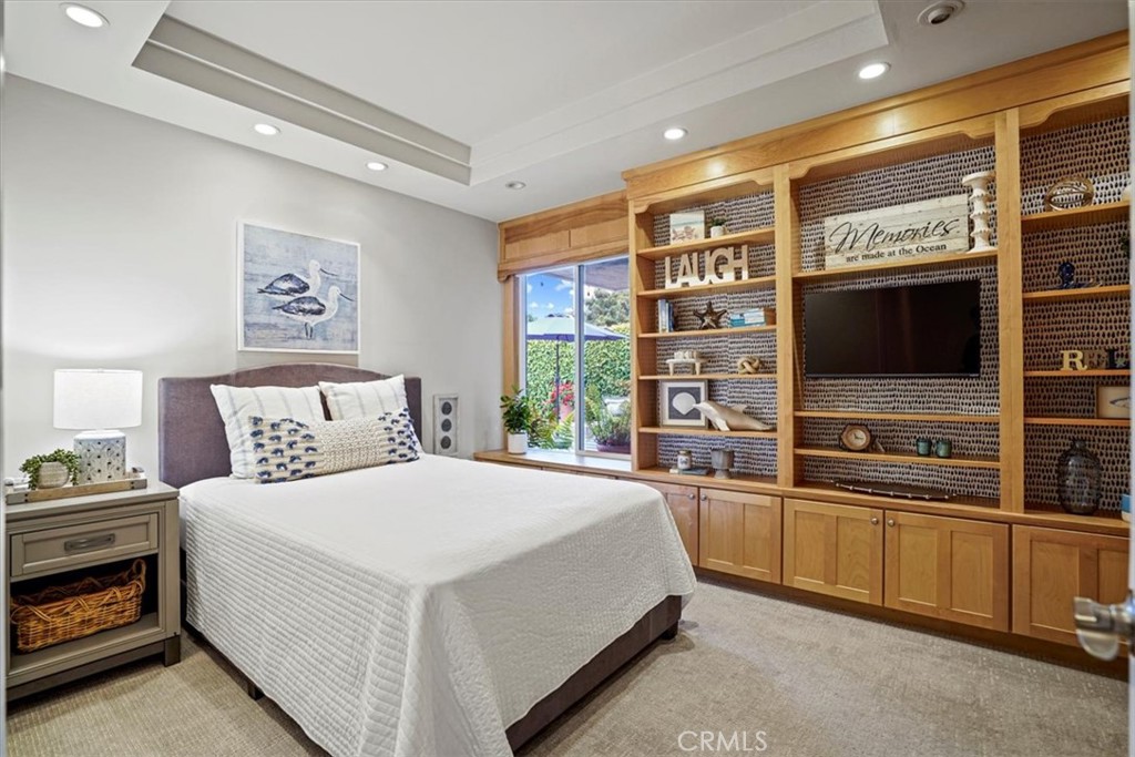 23802 Cassandra Bay Dana Point, CA 92629 - Photo 36 of 56 a bedroom with a bed and a flat screen tv