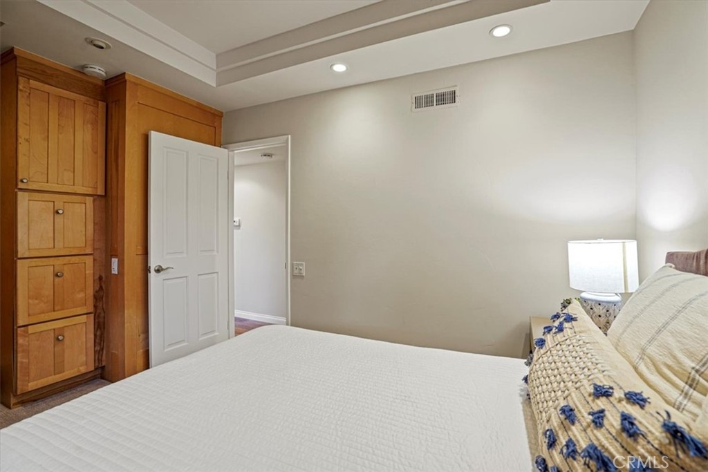 23802 Cassandra Bay Dana Point, CA 92629 - Photo 38 of 56 a bedroom with a bed and a mirror