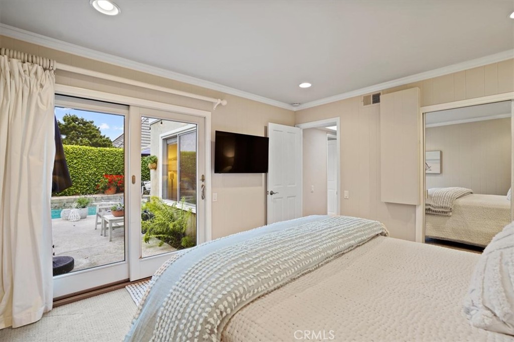 23802 Cassandra Bay Dana Point, CA 92629 - Photo 48 of 56 a bedroom with a bed and a flat screen tv