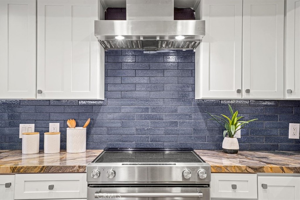 23802 Cassandra Bay Dana Point, CA 92629 - Photo 7 of 56 a kitchen with granite countertop stainless steel appliances stove top and cabinets