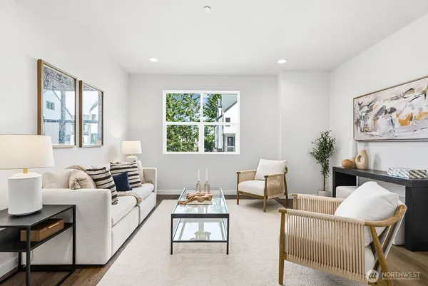 a living room with furniture and windows