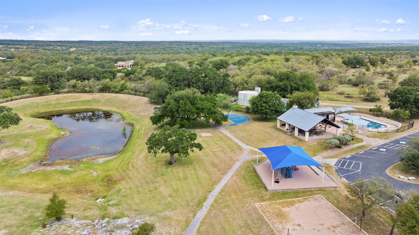 108 Cross Trail Spicewood, TX 78669 - Photo 10 of 36 a view of a swimming pool with a yard