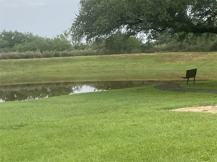 a view of a lake with a yard