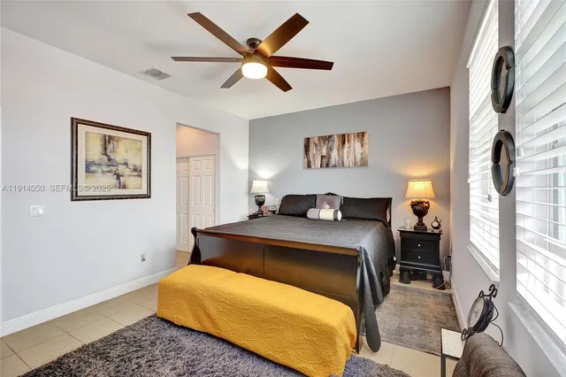 a bedroom with a bed and window