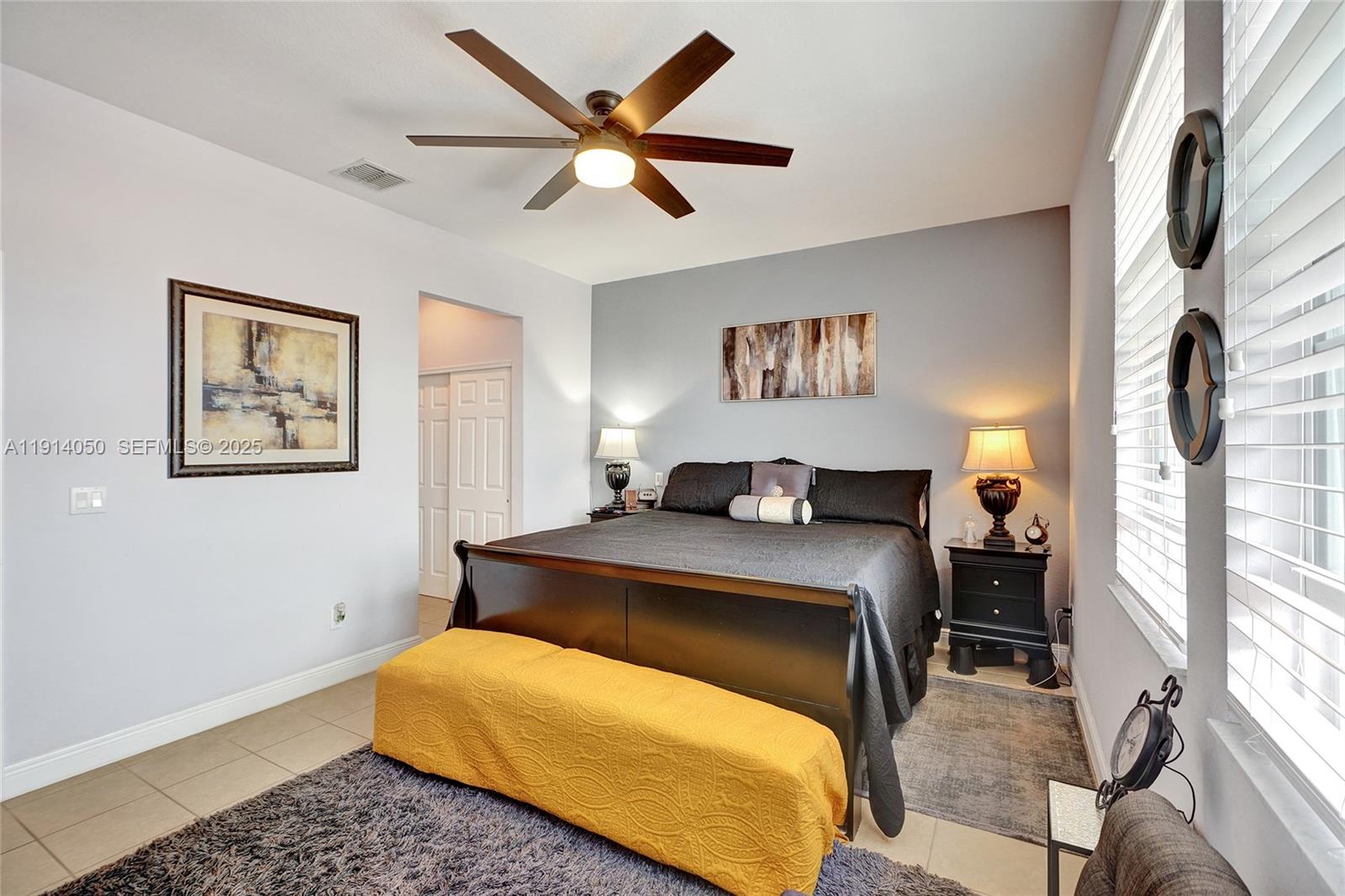 2659 Southwest 118 Road Miramar, FL 33025 - Photo 12 of 28 a bedroom with a bed and window