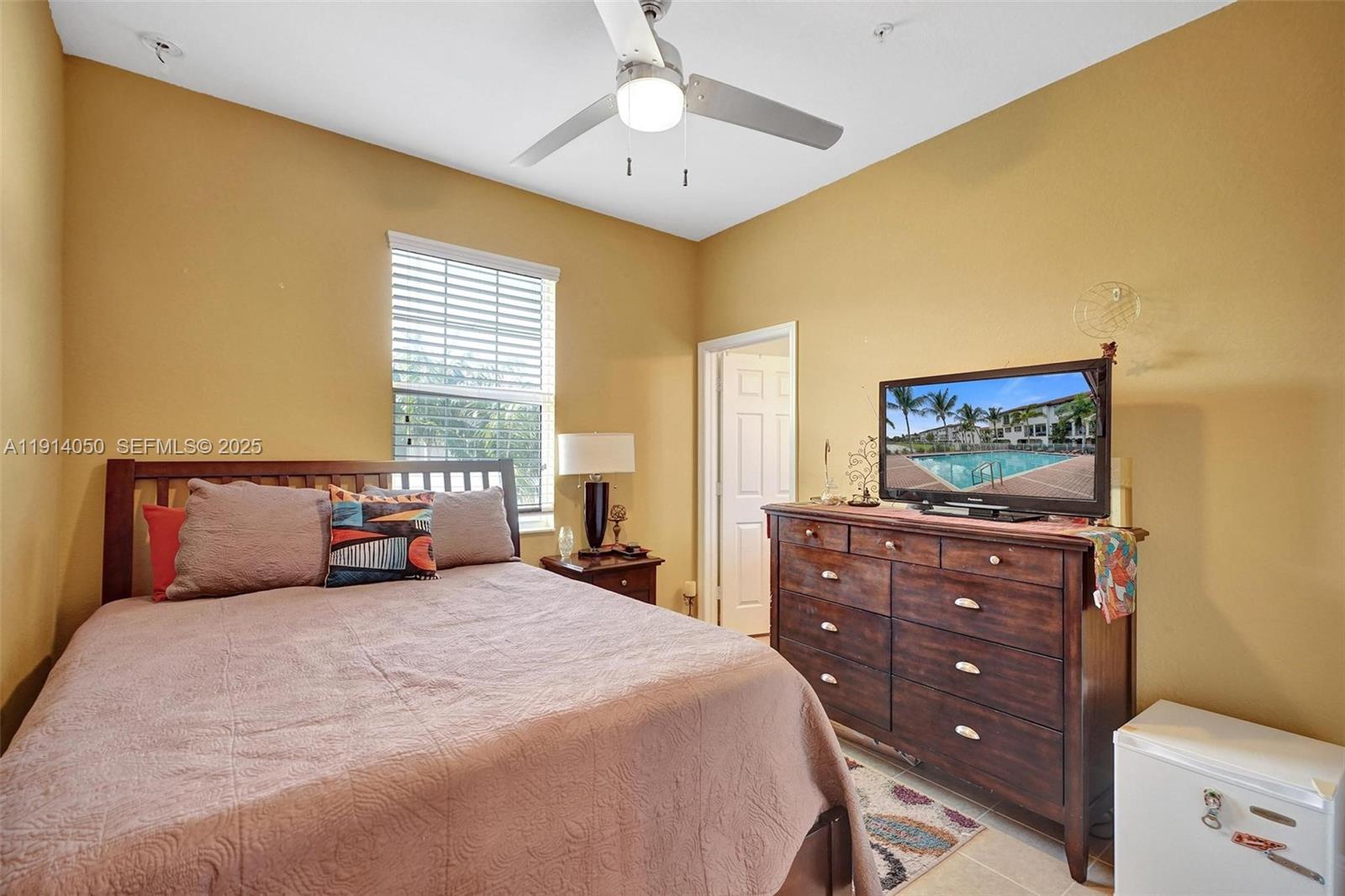 2659 Southwest 118 Road Miramar, FL 33025 - Photo 18 of 28 a bedroom with a bed and a dresser