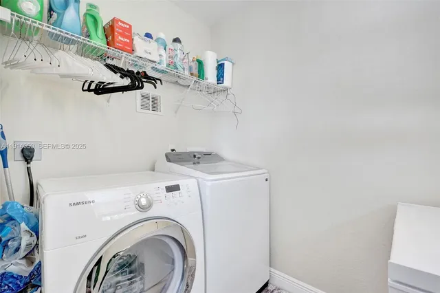 a utility room with dryer and washer