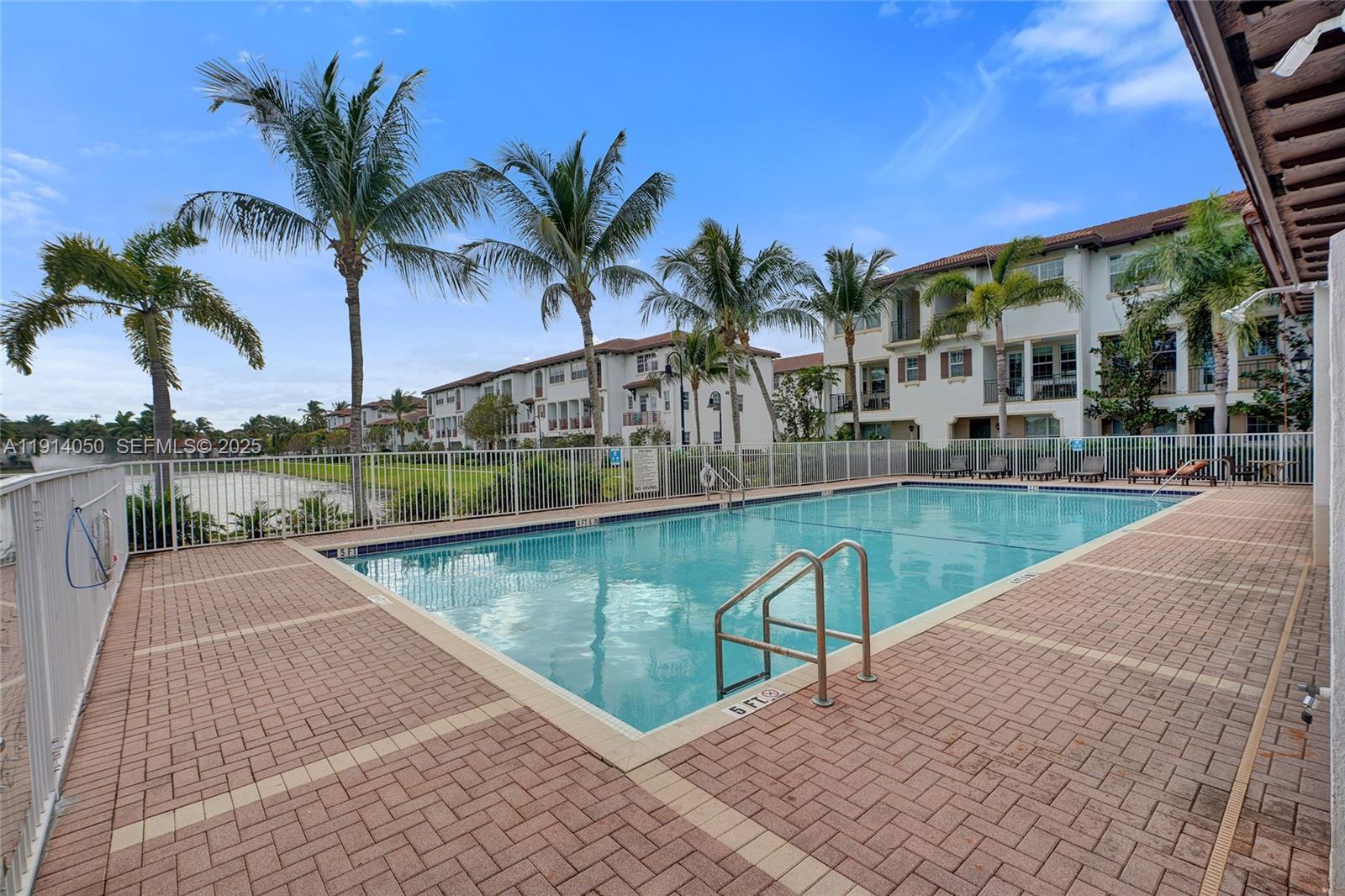2659 Southwest 118 Road Miramar, FL 33025 - Photo 28 of 28 a view of swimming pool with outdoor seating and plants