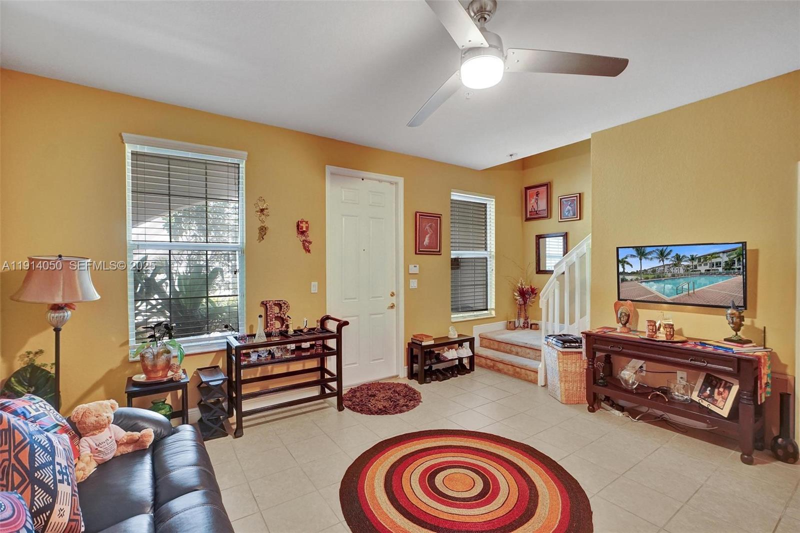 2659 Southwest 118 Road Miramar, FL 33025 - Photo 8 of 28 a living room with furniture and a floor to ceiling window