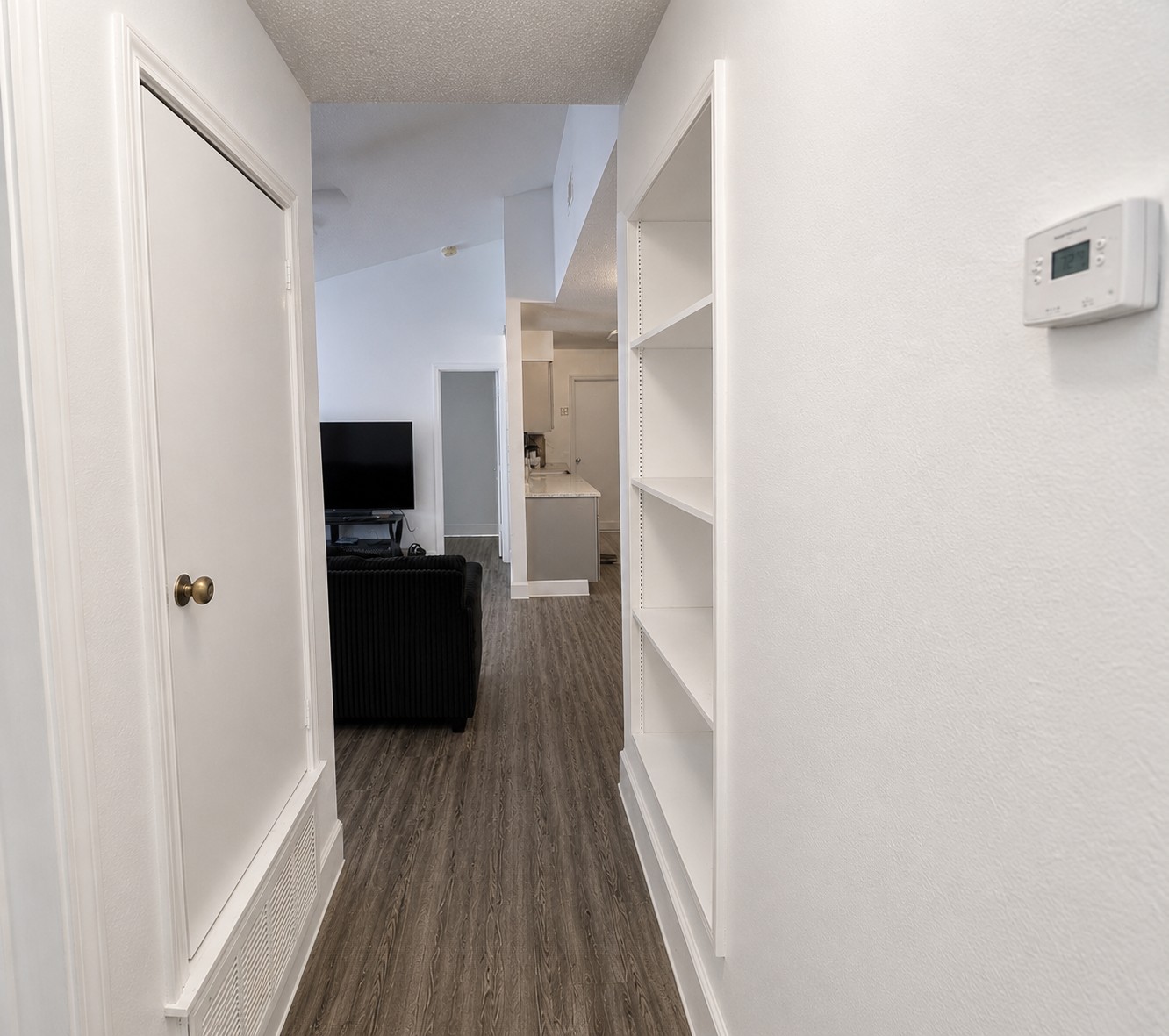 2013 Margalene Way Austin, TX 78728 - Photo 7 of 19 Clean lines and wood-look flooring guide guests through this inviting interior space.
