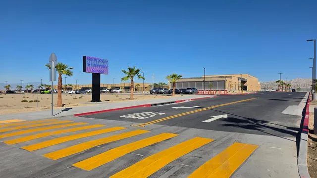 a view of a swimming pool with a outdoor seating and lake view