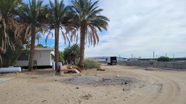 a view of a backyard with a sitting area