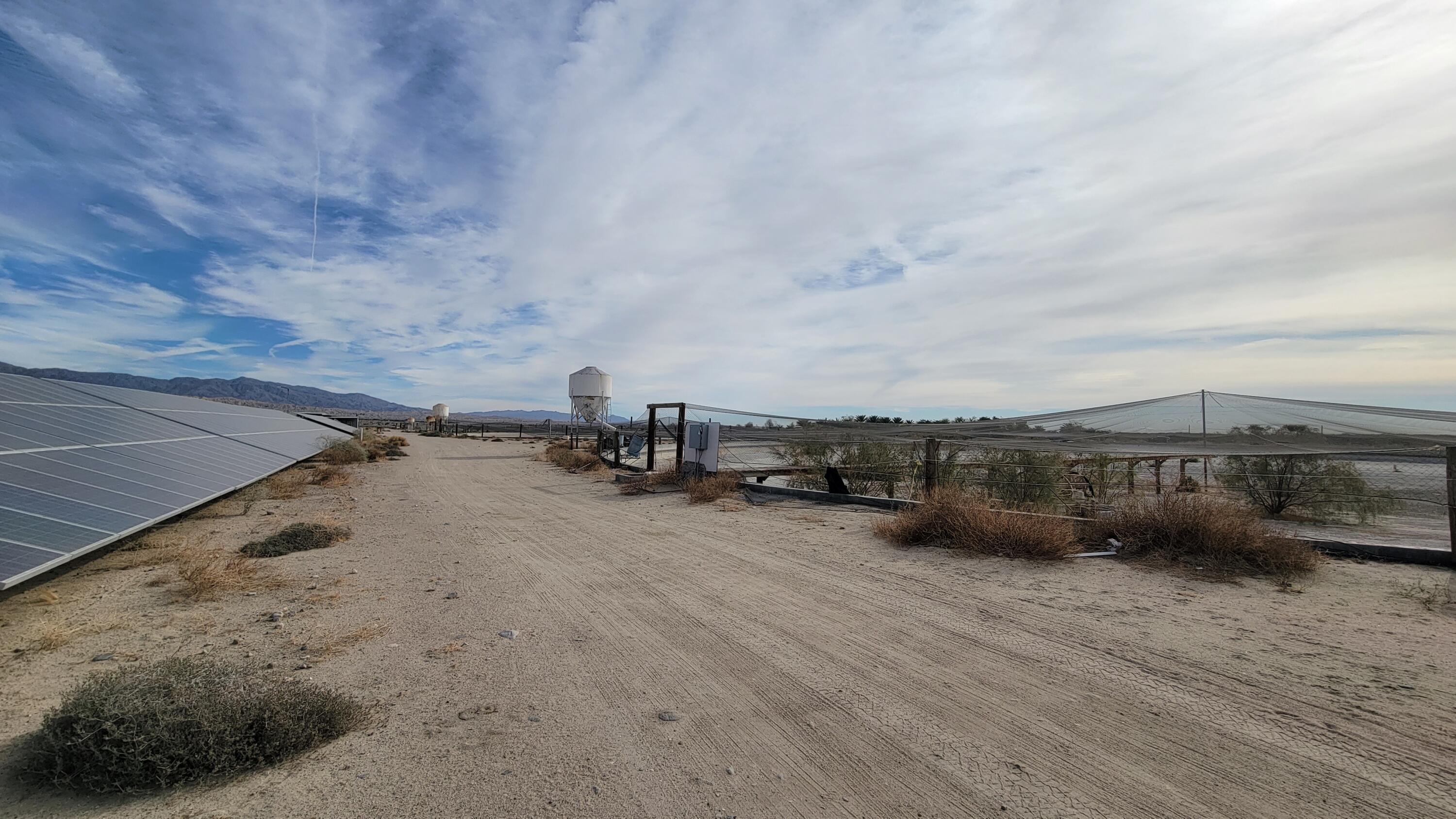96400 70th Avenue Mecca, CA 92254 - Photo 7 of 15 a view of a terrace with a bench