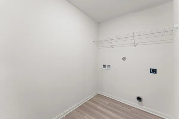 a view of a small space with wooden floor