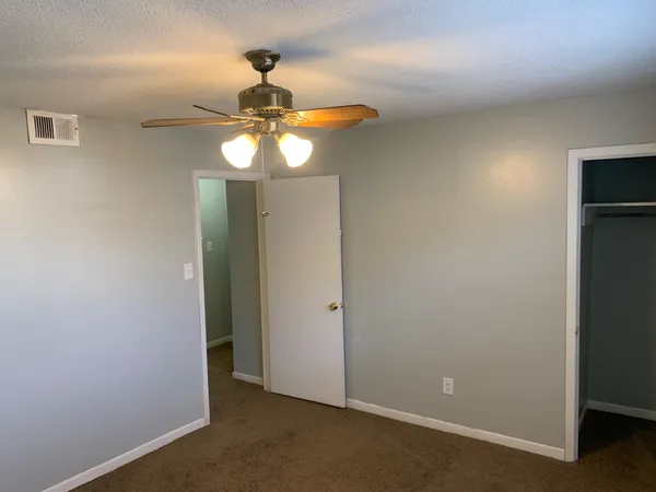a view of a chandelier fan in a room