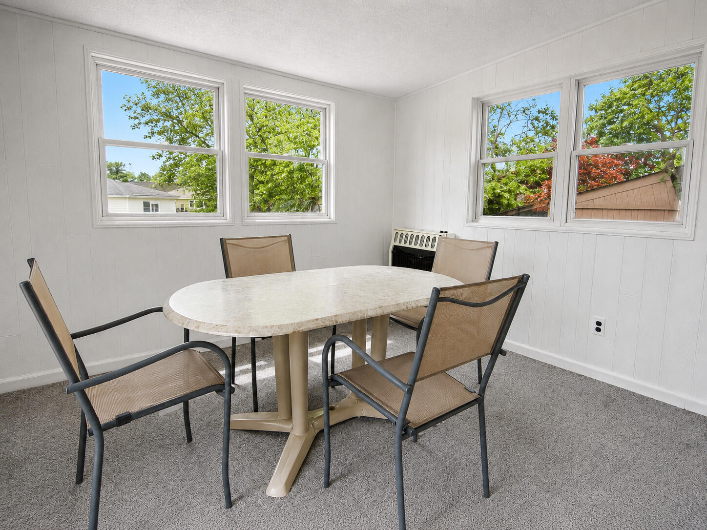 9502 Forrest Drive Highland, IN 46322 - Photo 24 of 27 a view of a dining room with furniture a rug and wooden floor