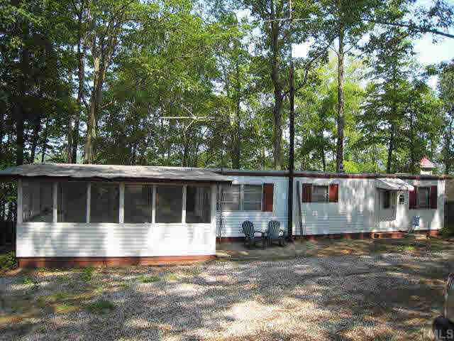 311 Kerr Lake Road Henderson, NC 27537 - Photo 1 of 10 a house view with a outdoor space