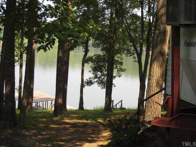 311 Kerr Lake Road Henderson, NC 27537 - Photo 4 of 10 a view of a backyard