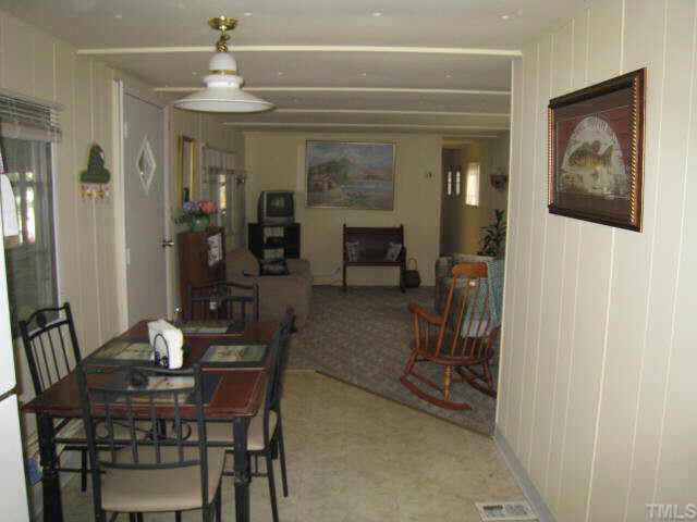 311 Kerr Lake Road Henderson, NC 27537 - Photo 7 of 10 a view of a dining room with furniture