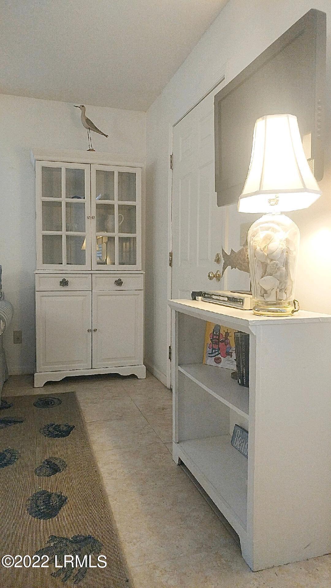 1983 Seaside Road St. Helena Island, SC 29920 - Photo 8 of 27 1983 ss living area corner curio